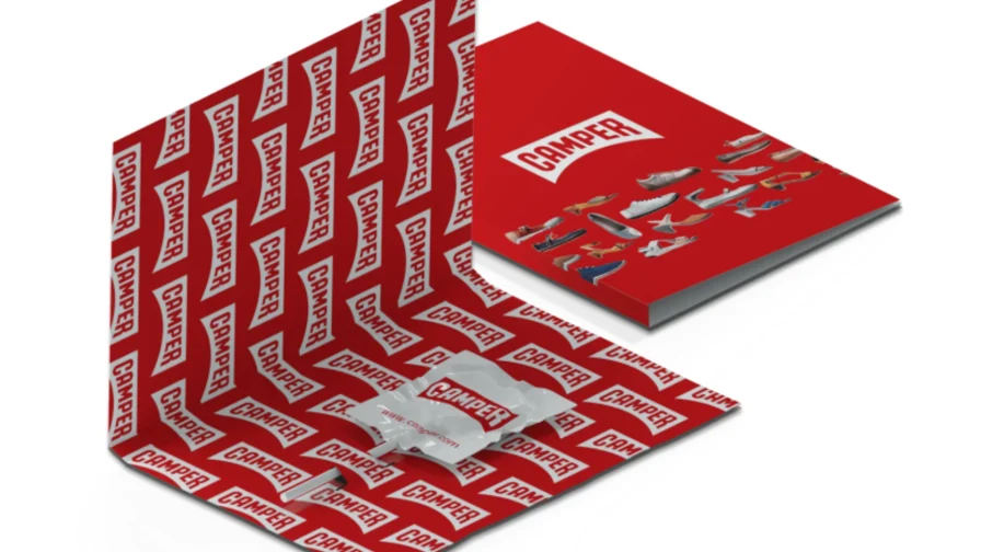 Packaging tipo carpeta decorado con el logotipo de una empresa y con una piruleta en su interior